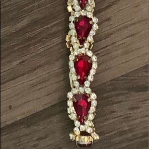 Gold bracelet with red stones and cubic zirconia